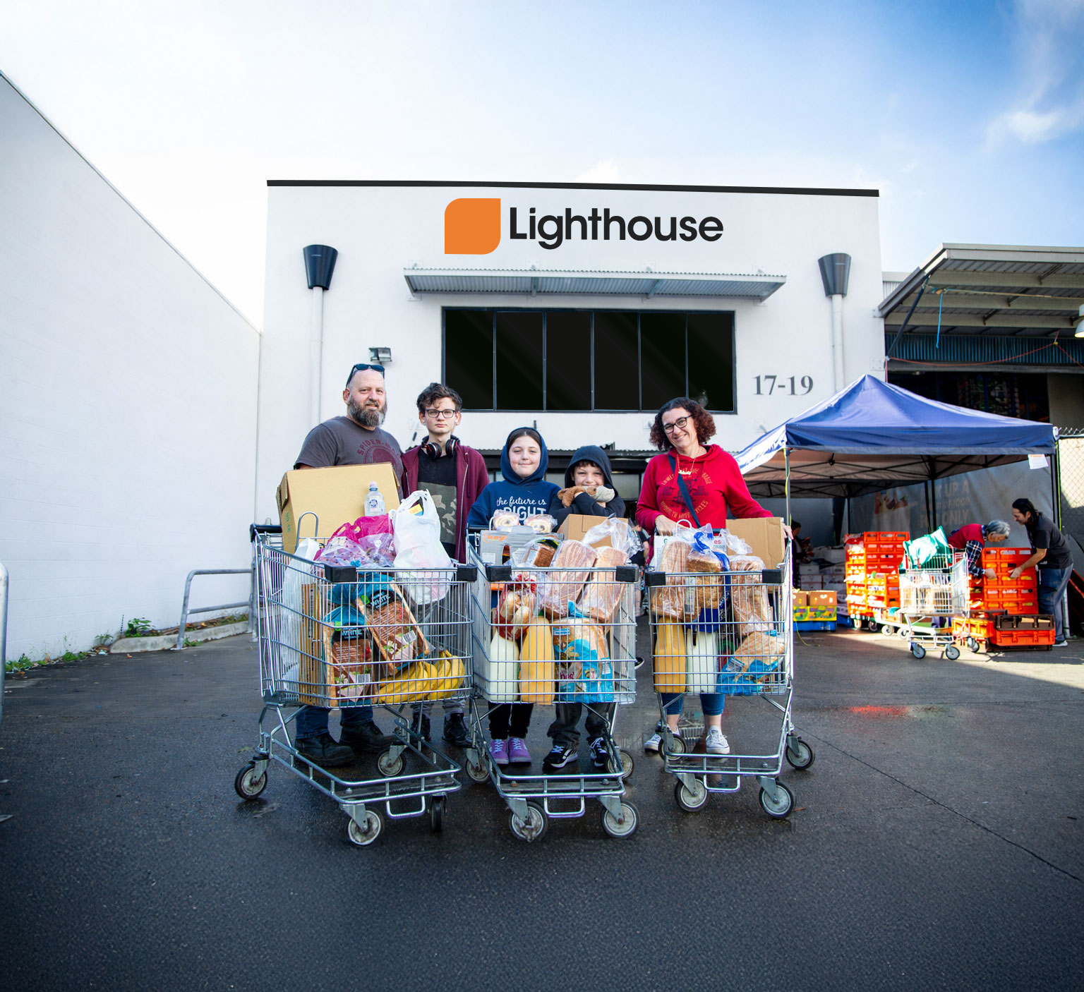 Family with trolleys of food
